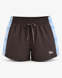 Brown athletic shorts with a white drawstring, blue and white  plaid pattern on the sides, featuring a small white 'CM' logo on the lower left leg.