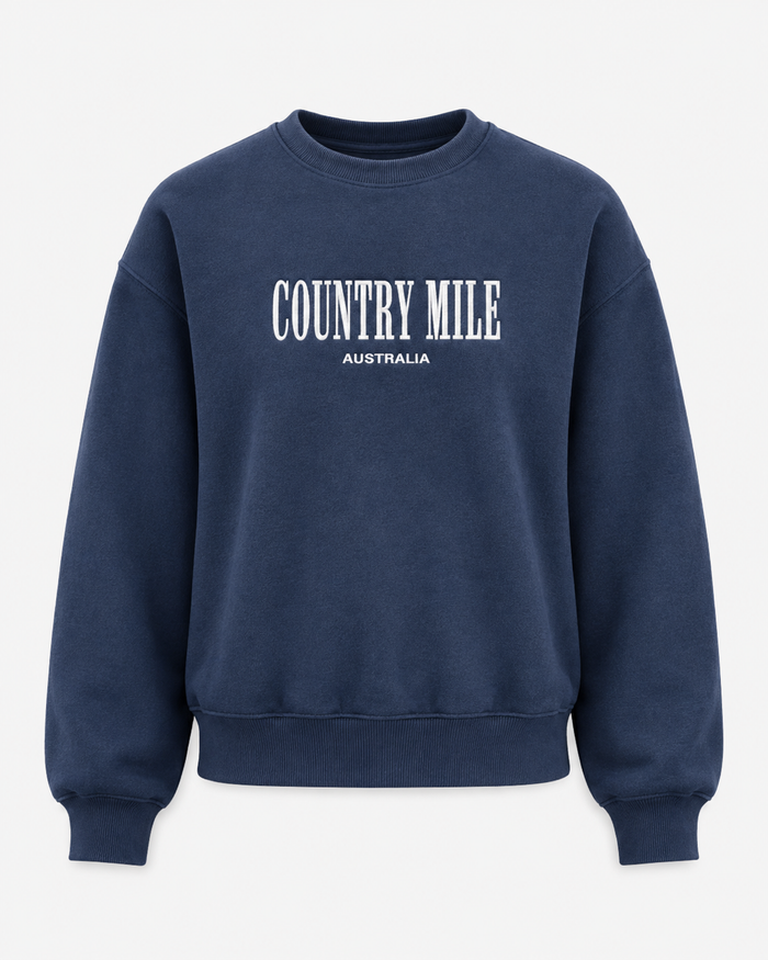 A navy blue crewneck sweatshirt with 'COUNTRY MILE AUSTRALIA' printed in white across the chest, displayed on a clean white background.