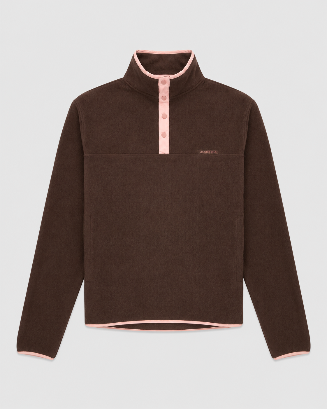 Flat lay of the Tilly Fleece in brown with pink trim, standing collar and snap button placket