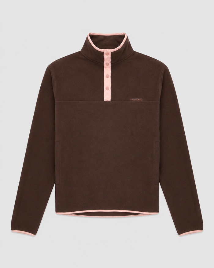 Flat lay of the Tilly Fleece in brown with pink trim, standing collar and snap button placket